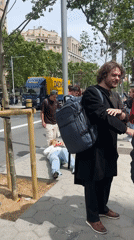 Person found lying on Barcelona street, bystander present