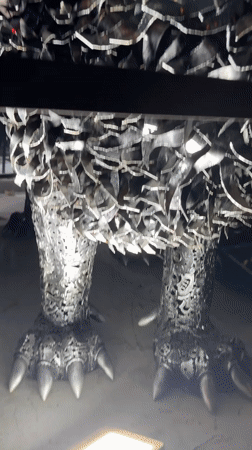 Dubai outdoor exhibit showcases massive scrap-metal sculptures at night