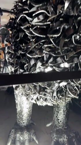 Dubai outdoor exhibit showcases massive scrap-metal sculptures at night