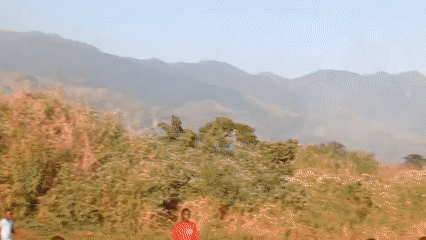Children play soccer in rural Congolese village field