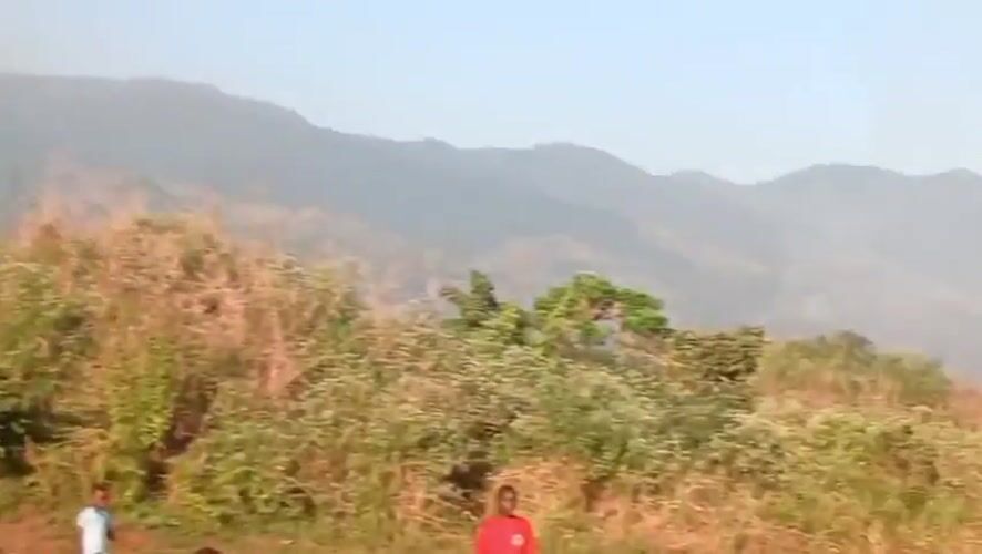Children play soccer in rural Congolese village field