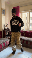 Man dances and smokes in Tangier apartment during morning hours