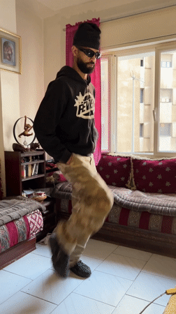 Man dances and smokes in Tangier apartment during morning hours