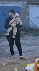 Family moments documented in Noviy, Russia during spring afternoon
