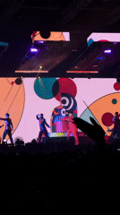 Male singer performs elaborate concert with dancers and visual effects
