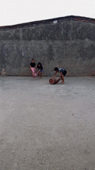 Children play with clay pots during sunset evening