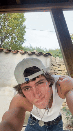 Young man spotted in white tank top around Lourmarin