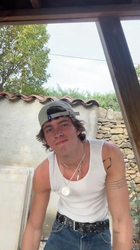 Young man spotted in white tank top around Lourmarin