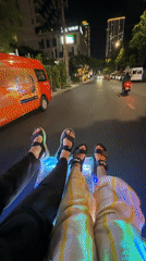 Tourists dangle feet from glass-bottom boat in Nha Trang
