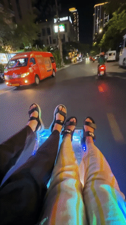 Tourists dangle feet from glass-bottom boat in Nha Trang