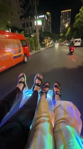 Tourists dangle feet from glass-bottom boat in Nha Trang