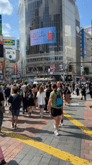 Morning rush hour unfolds at Tokyo's bustling Shibuya crossing