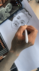 Artist creates baby portrait using phone photo reference in Kuta