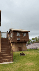 Elevated twin cabins spotted on pillar supports in Wisconsin Dells