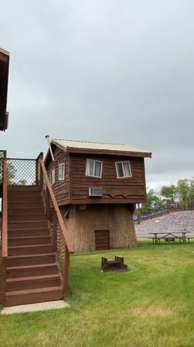 Elevated twin cabins spotted on pillar supports in Wisconsin Dells
