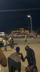 Nighttime street market activity in Bukuru, Nigeria