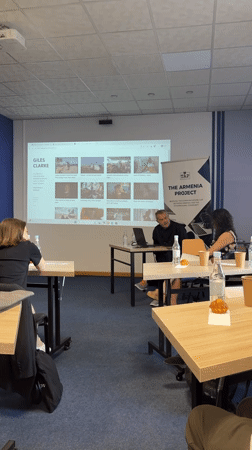 Man leads laptop presentation in Yerevan conference room