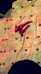 Performers scale climbing wall during live stage show in Belgrade