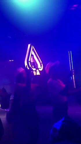 Late-night club scene in Nigeria with dancing and neon lights