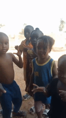 Children play and dance in Akwanga neighborhood Saturday afternoon