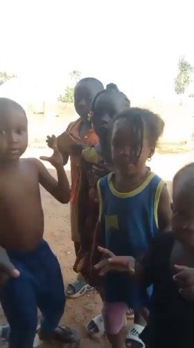 Children play and dance in Akwanga neighborhood Saturday afternoon