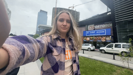Woman records selfie video on Esenyurt street