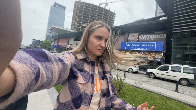Woman records selfie video on Esenyurt street