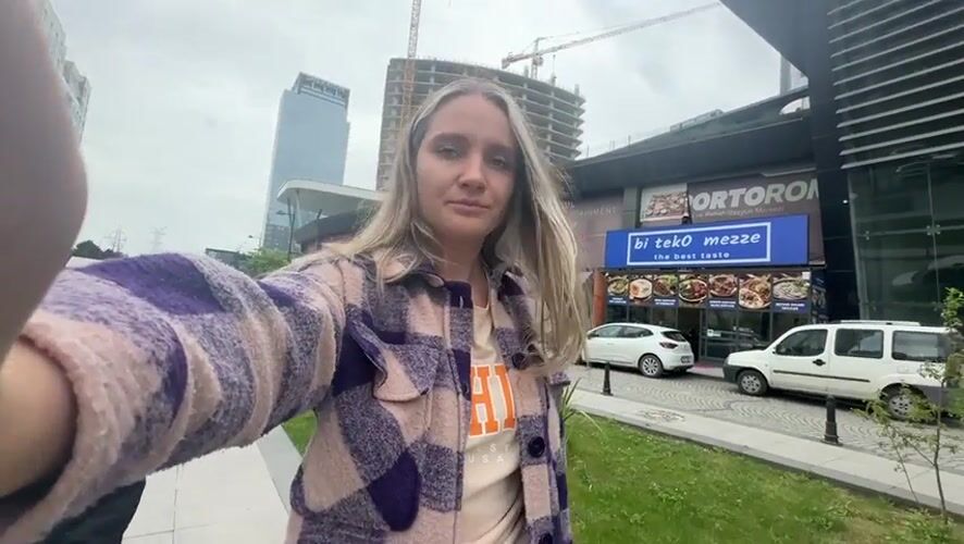 Woman records selfie video on Esenyurt street