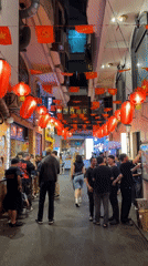Festive alleyway bustling with decorated businesses in Thủ Đức Vietnam