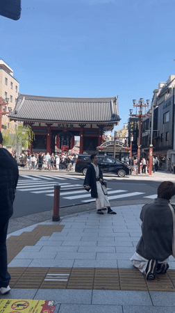 Tourist poses in traditional dress at Tokyo's Sensō-ji temple