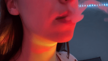 Woman exhales smoke in illuminated Saint Petersburg scene
