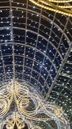 Minsk evening: lit archways, chandeliers, and a candlelit restaurant