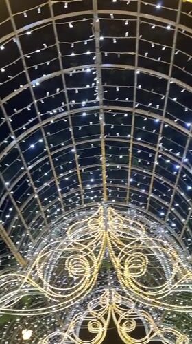 Minsk evening: lit archways, chandeliers, and a candlelit restaurant