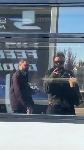 Train passenger films selfie video in window reflection