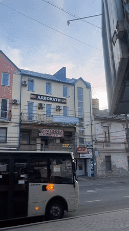 Quiet afternoon in Ternopil features sleepy cat, street scenes