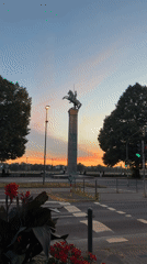Equestrian statue silhouetted against Düsseldorf's evening sky