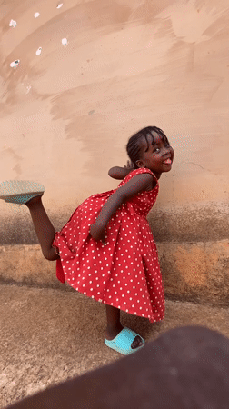 Children play outdoors in sunny Kuru Dungus, Nigeria