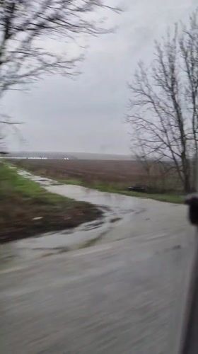 Morning drive captured on wet Bulgarian roadway