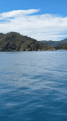 Ocean waves and green mountains filmed near Fethiye, Turkey