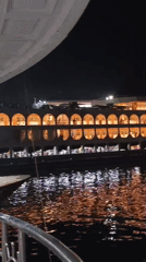 Busy nighttime ferry port scene documented in Dhaka