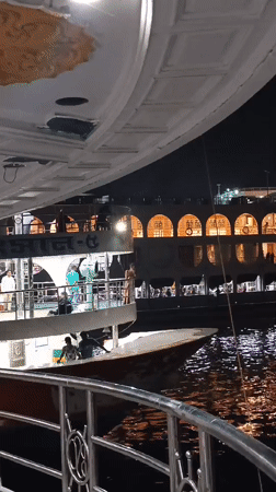 Busy nighttime ferry port scene documented in Dhaka