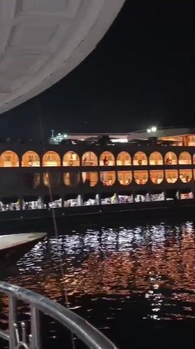 Busy nighttime ferry port scene documented in Dhaka