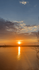 Sunset, truck, dog captured in Chaikovsky spring afternoon