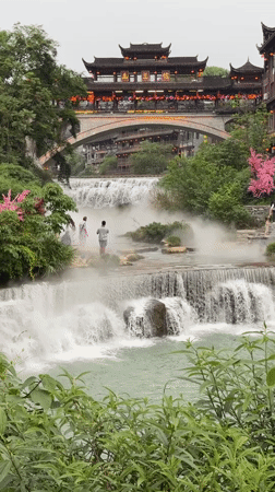 Scenic waterfall and traditional townscape captured in Furong, China