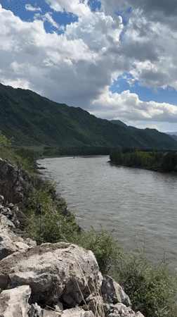 Climber documents river views from rocky heights near Edigan