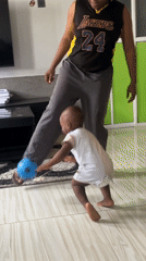 Toddler plays with balls in Nigerian living room