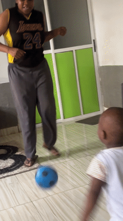 Toddler plays with balls in Nigerian living room