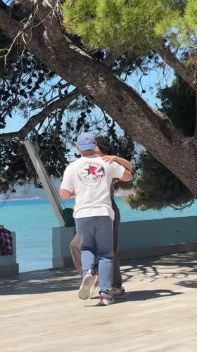 Couple dances, beachgoers enjoy sunny morning in Bar, Montenegro