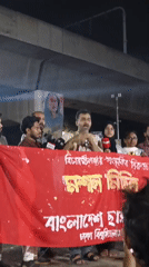 Nighttime public gathering with speakers in Dhaka, Bangladesh