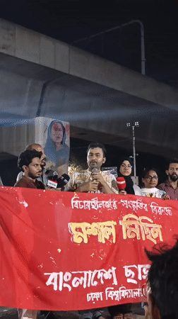 Nighttime public gathering with speakers in Dhaka, Bangladesh